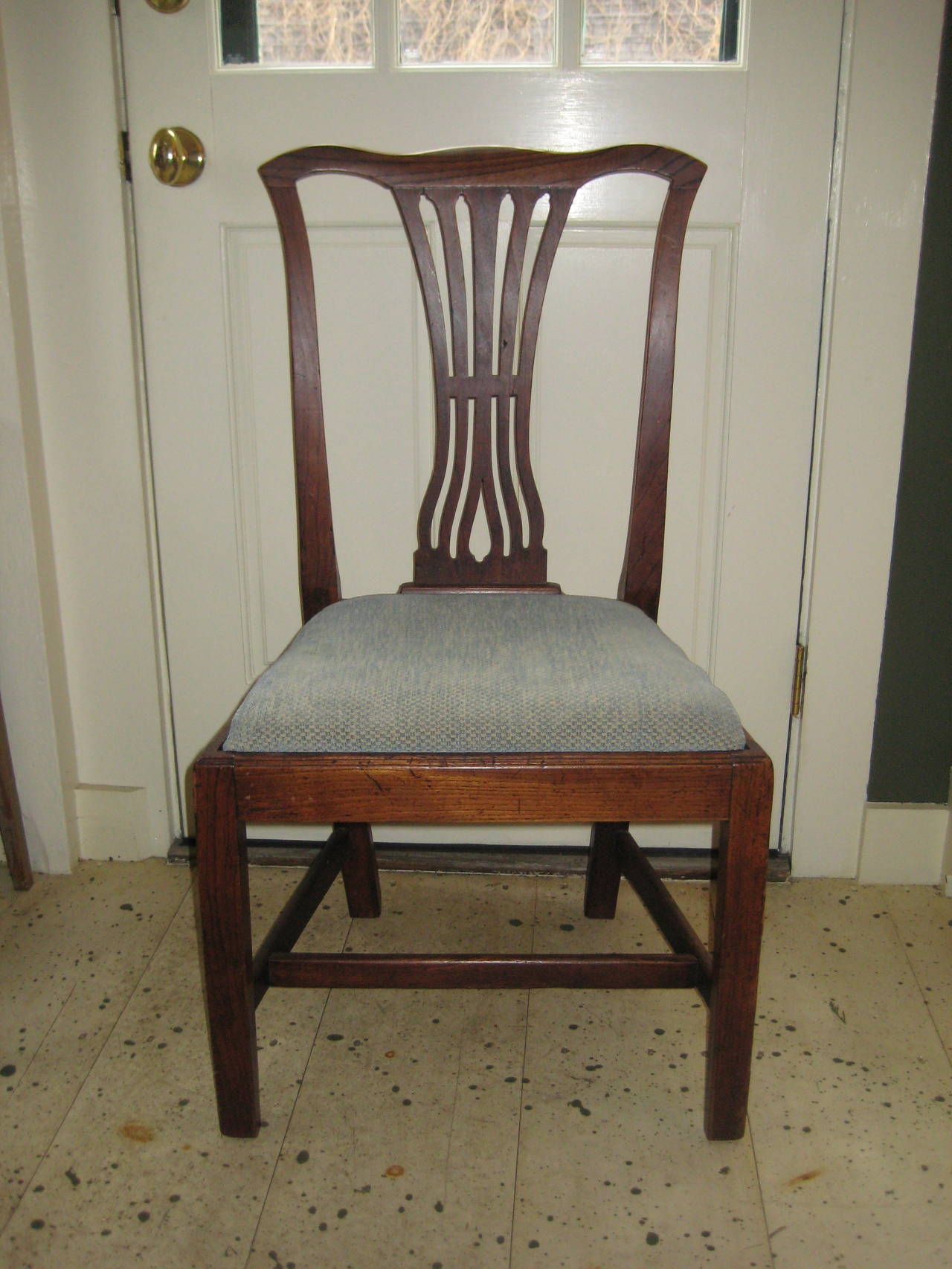English oak Chippendale side chair with upholstered seat.