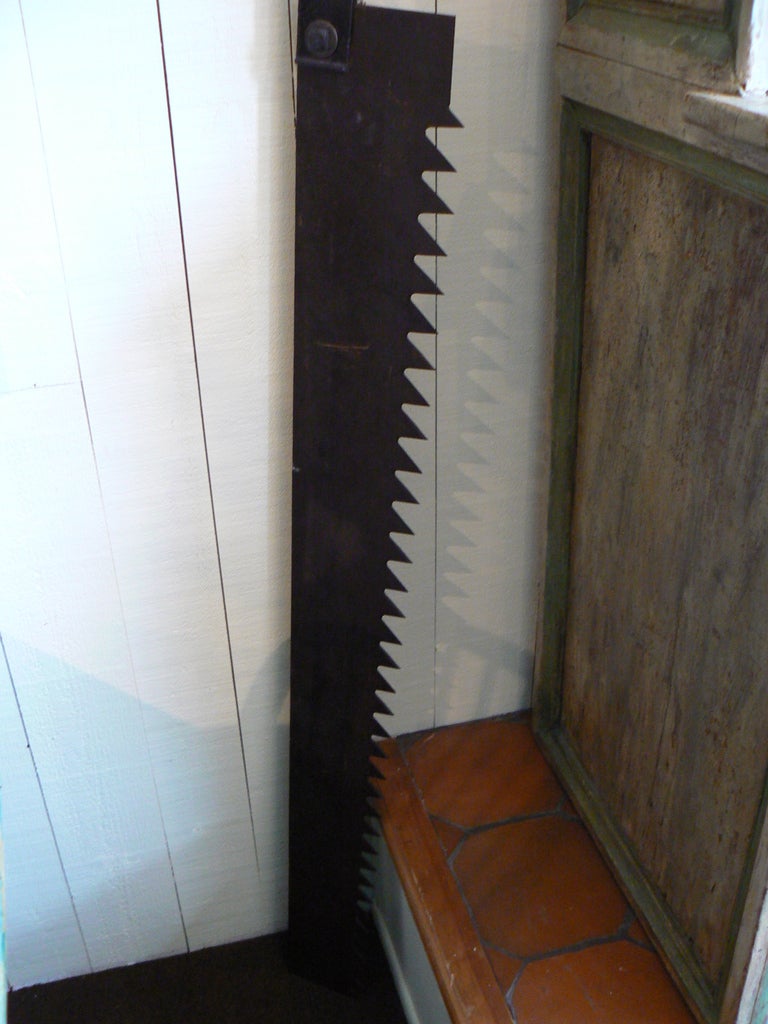 Antique ice saw with fine wood and metal handle