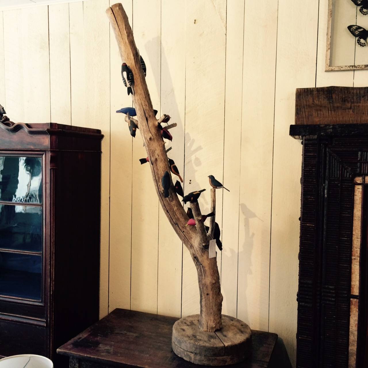 Canadian folk art bird tree made with natural branches and 19 hand carved birds representing 8 different species.