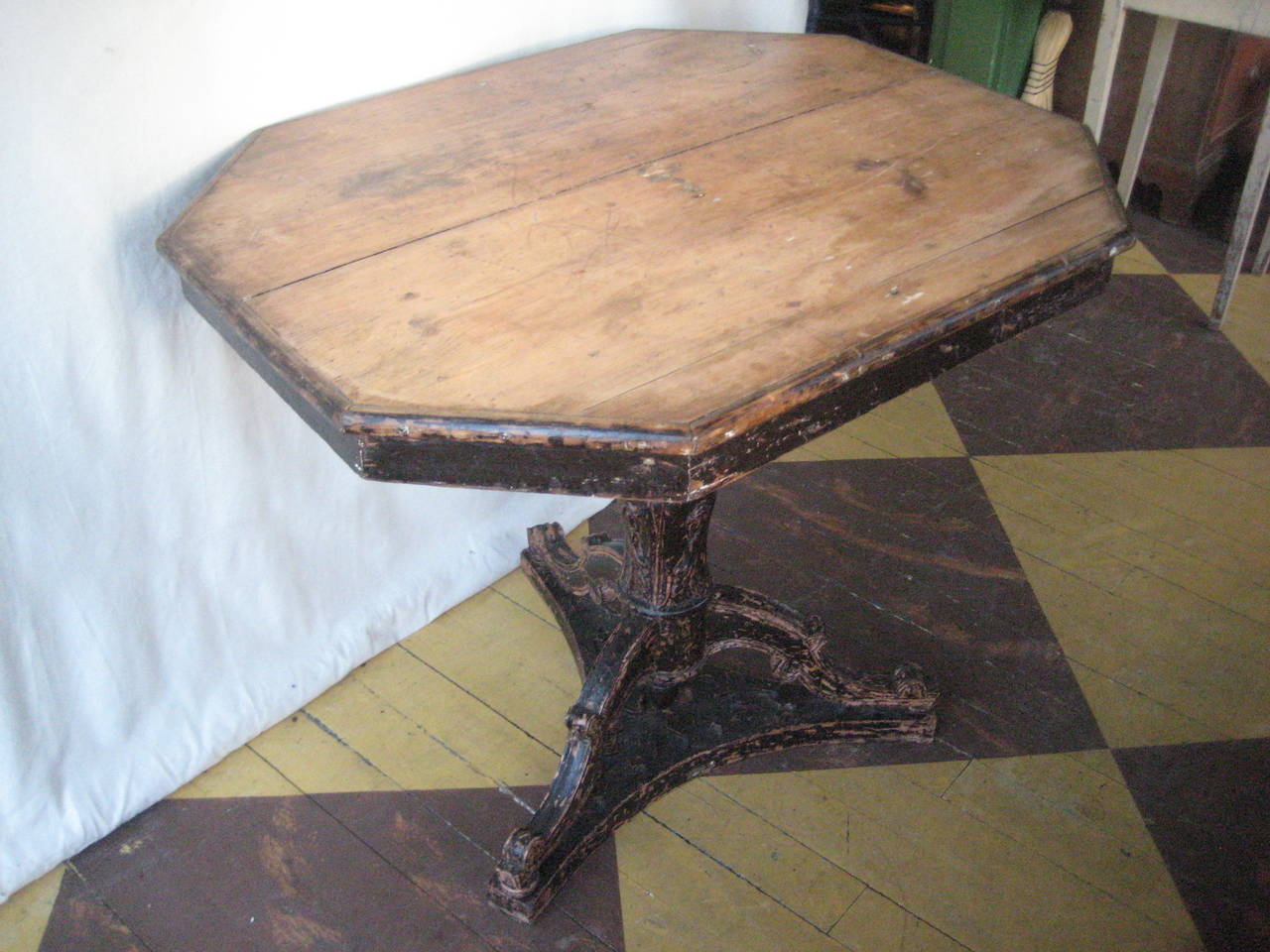 Pine Pedestal based Octagonal table with carved acanthus leaves.