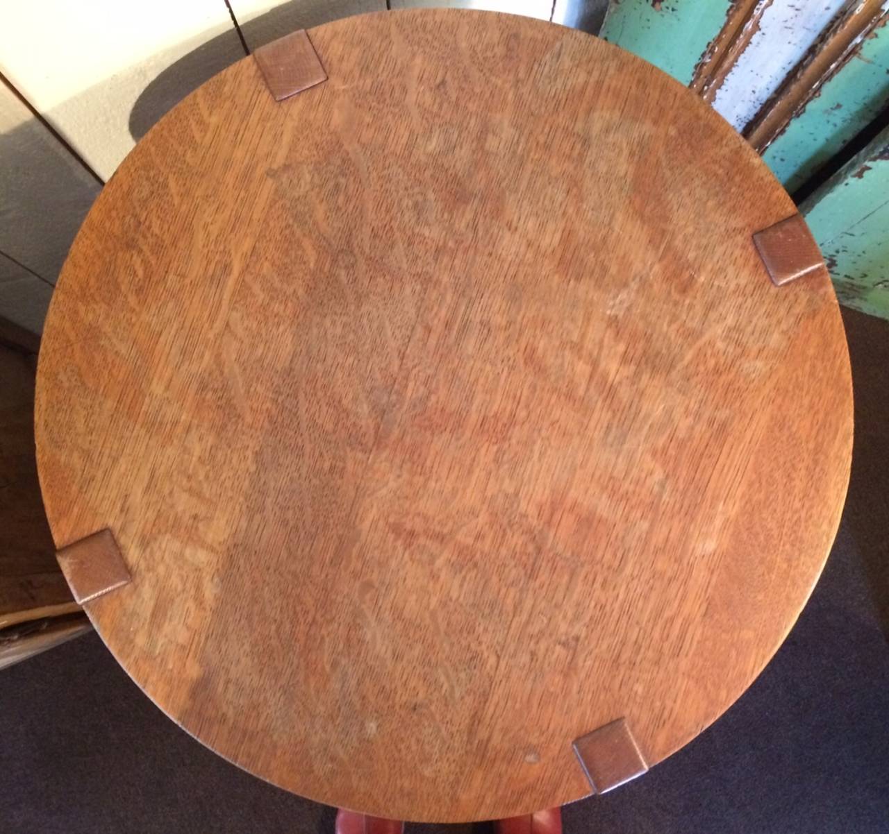 Stickley Brothers lamp table with vestiges of original paper tag. Structurally sound with minor fading and expected usage wear on table top surface.