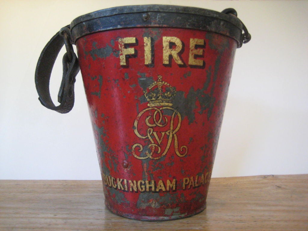 English Red metal fire bucket with a leather handle.  