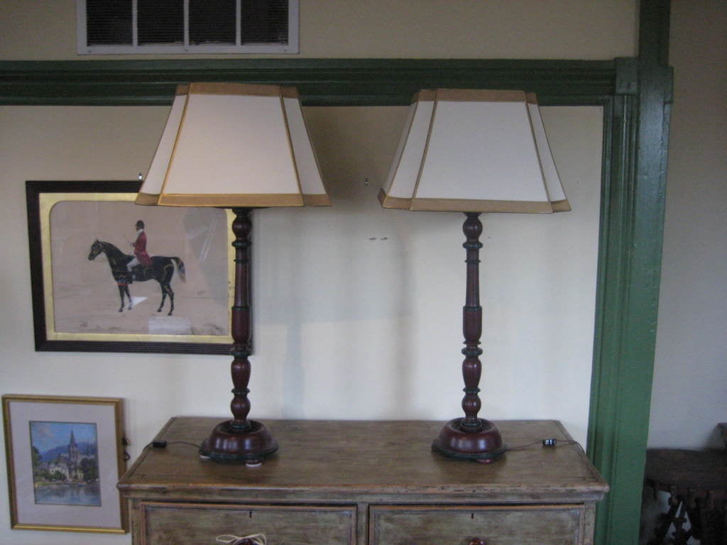 Pair of Red and green painted English tall candlestick lamps with custom shades.