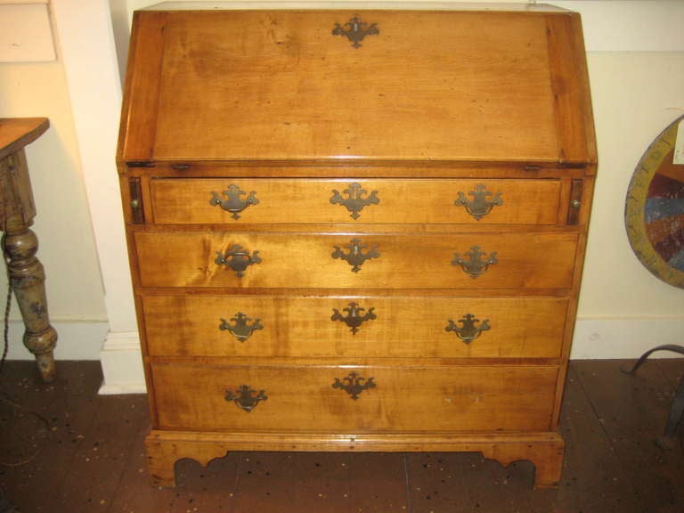 Early 19th Century American tiger maple slant top desk.