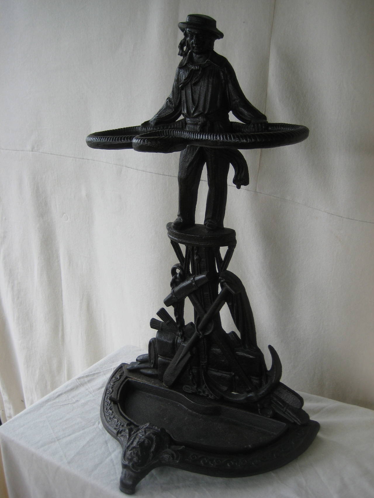 Cast Iron Umbrella Stand with a Sailor and his gear.