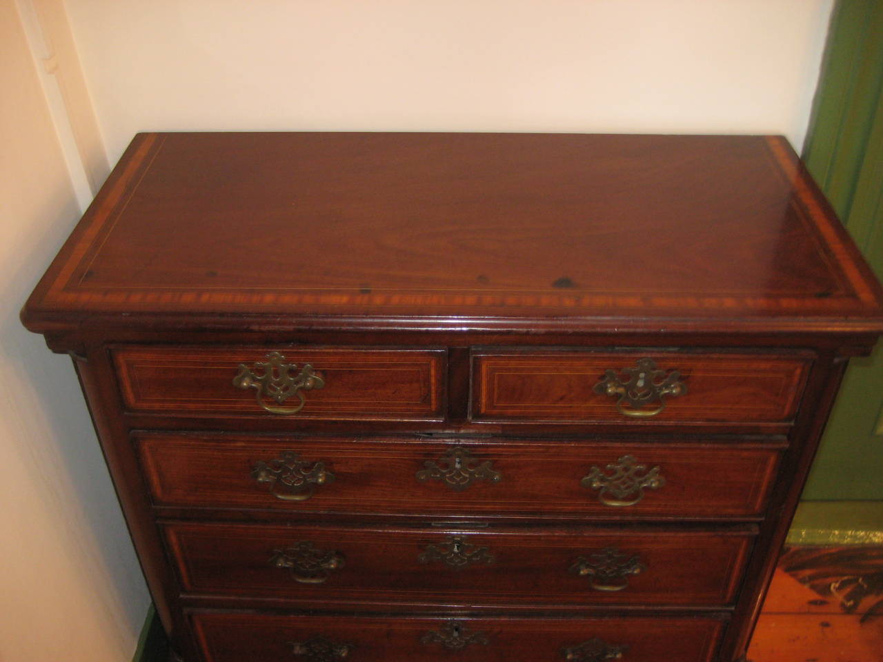 English 19th Century inlaid small chest of drawers.