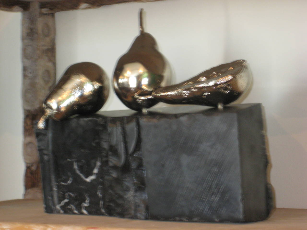 Sculpture in Soapstone, bronze and nickel plate.