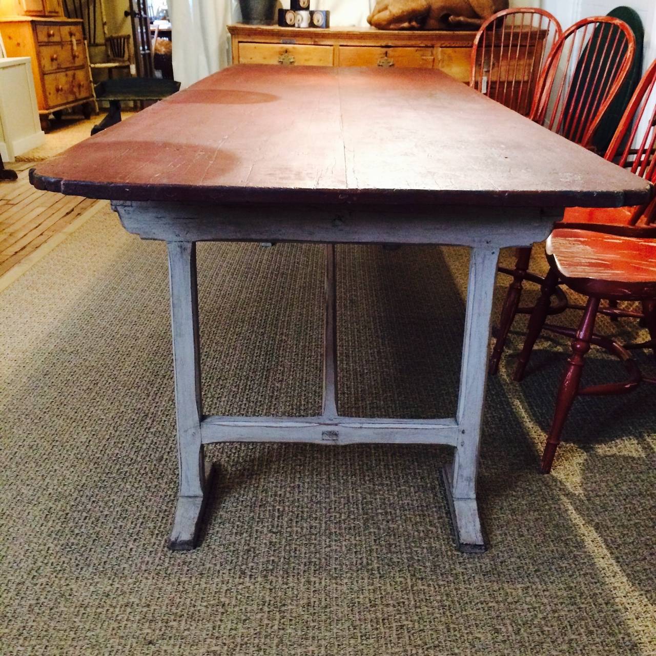 19th Century dining table of likely Canadian origin.  Early to mid-19th Century. Features stretcher base, shoe feet and ovolo corners.