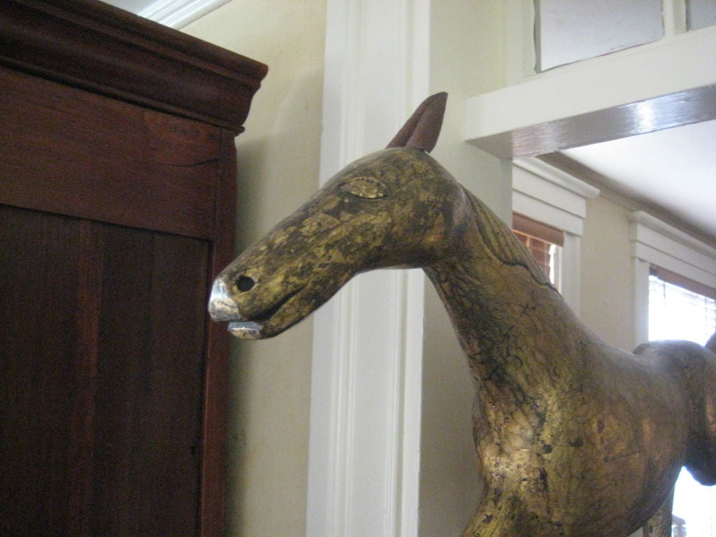 hand carved, gilded; shown on wall bracket, other mounting options available