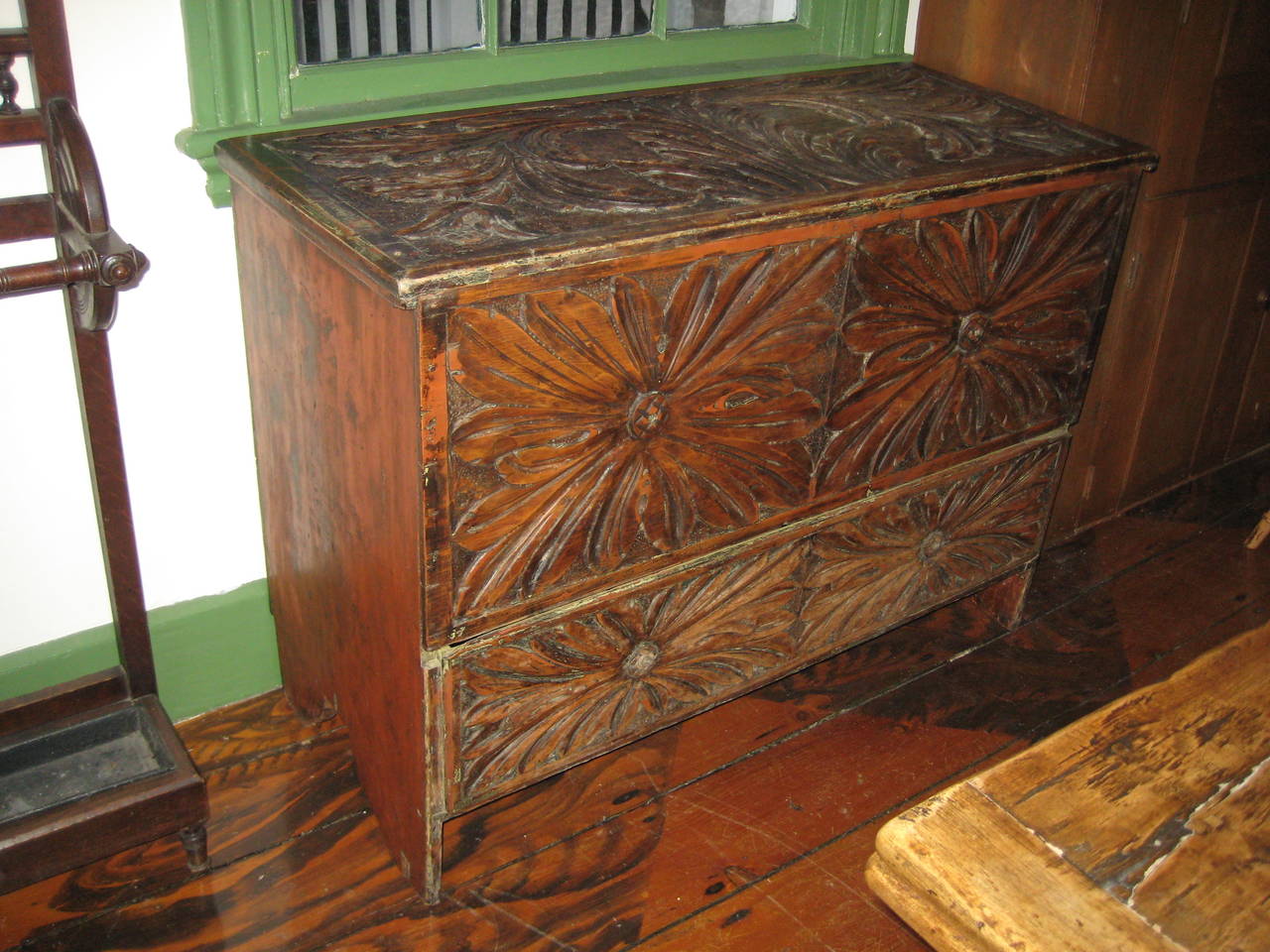 Mule chest with relief carving, tulip and acanthus leaf motif.