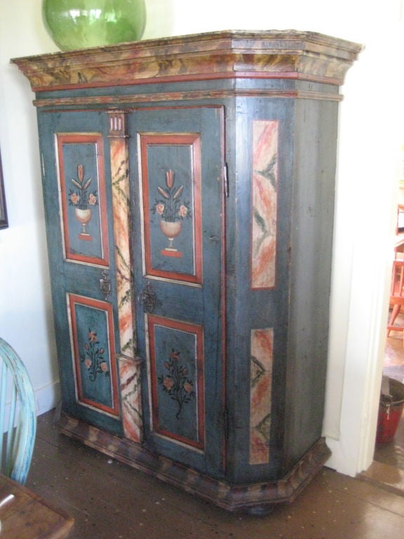 painted cupboard with shelves on right side and hanging on left side