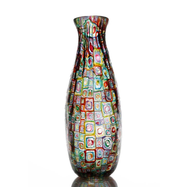Robin Mix is a glassblower who's murrhini glass is characterized by bold concentric squares and ribbons of color, fused and drawn into fluid and functional vessels.