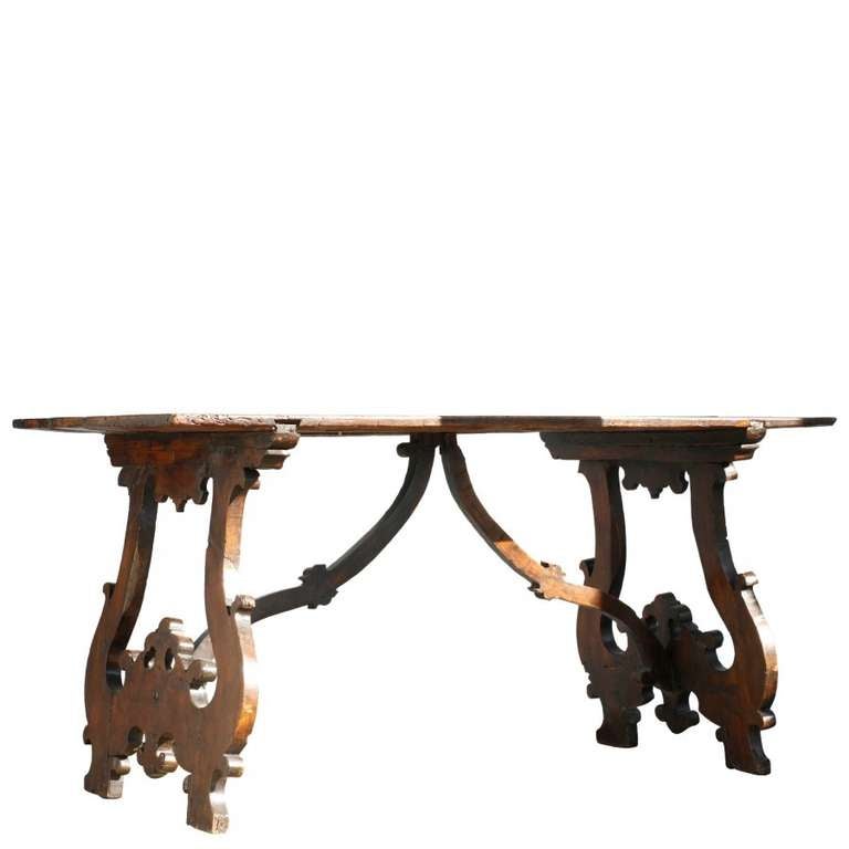 Carved from solid oak and originating in the 18th century, this table beautifully embodies motifs from the Italian Baroque era.