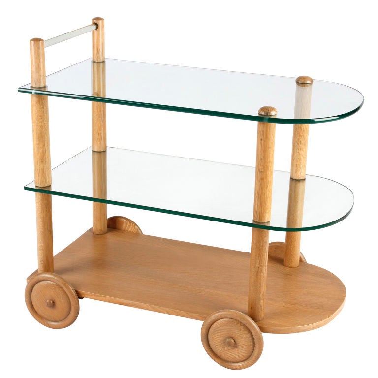 Bar cart, Gilbert Rohde, circa 1940. Clean, simple, honest design. To accomodate smaller living spaces, he created furniture with dual purposes. A designer for Herman Miller.