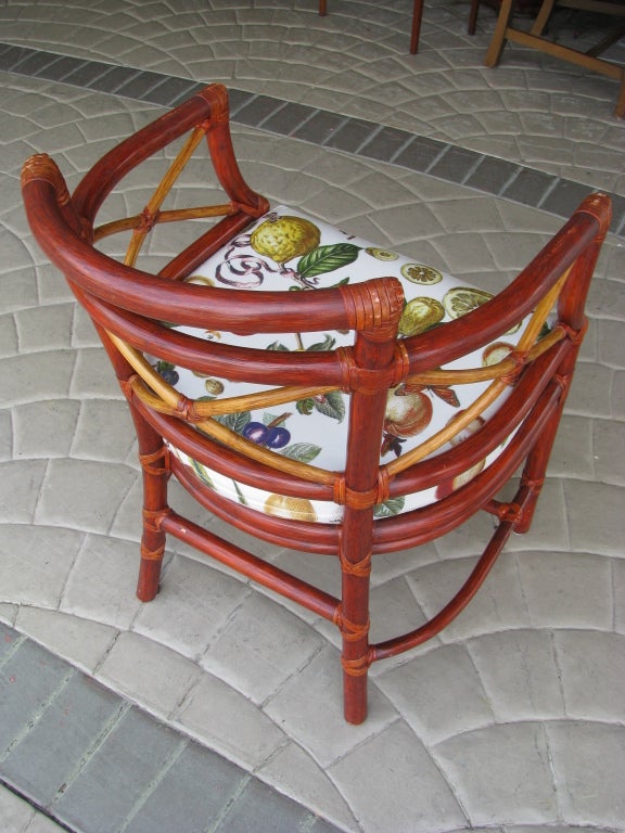 Crescent Bamboo with Rattan wrapped joints in blends of Rust & Amber. 
Fruit and Butterfly Pattern, Vinyl Covered Upholstery Cushion.