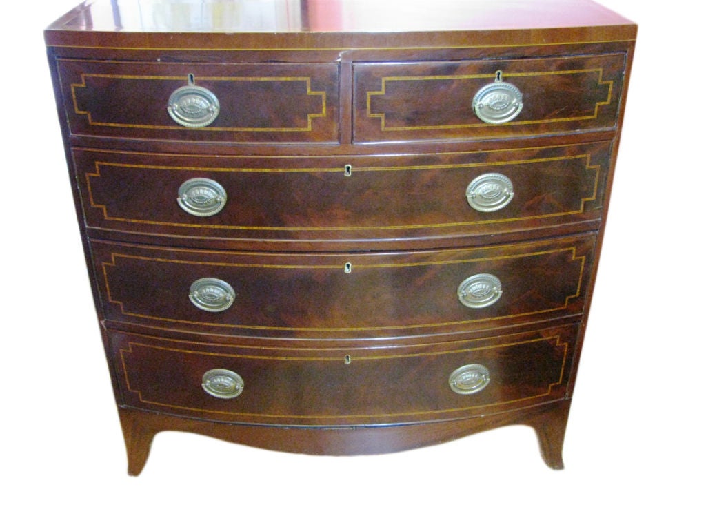 Mahogany 5-drawer bowfront chest.  Top and drawers have burlwood banding with cockbead detail on drawers.  Splay feet with mitred joints.  Carcass has dovetail fitted construction.