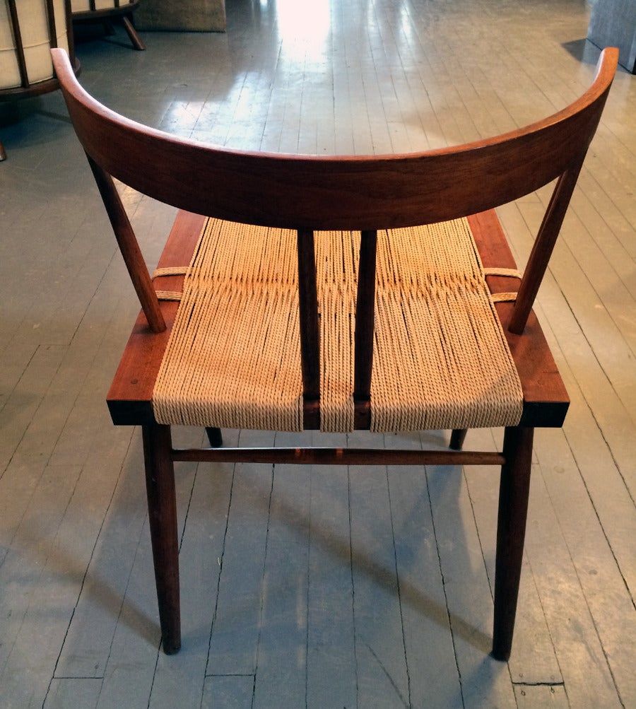 Set of Four Walnut and Woven Seat Chairs by George Nakashima 1