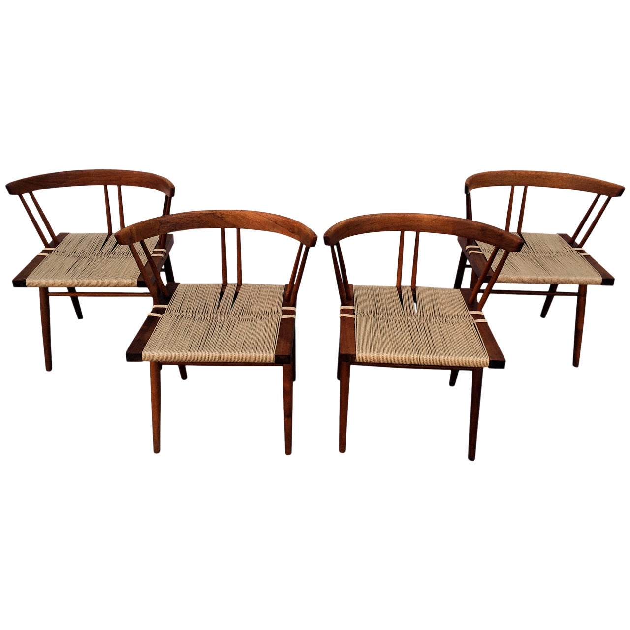 Set of Four Walnut and Woven Seat Chairs by George Nakashima