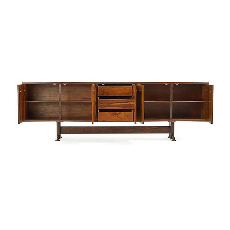 A large credenza or sideboard made of Brazilian rosewood circa 1950s. Designed for FORMA by Martin Eisler (1913-1977) and Carlo Hauner (1927-1997), two venerable designers who spearheaded Brazilian mid-century modern movement with their