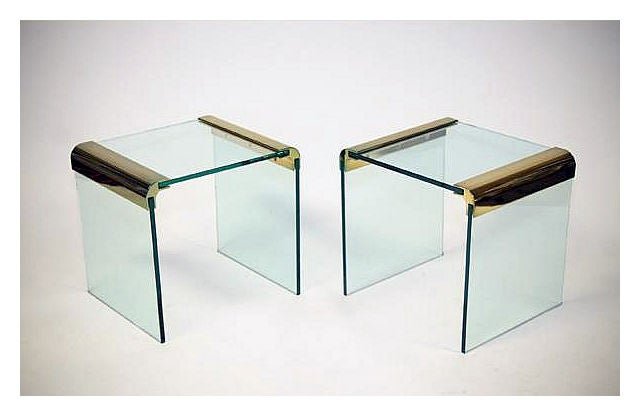A beautiful pair of waterfall form occasional side table by Pace Italy. Heavy glass construction with brass brackets.