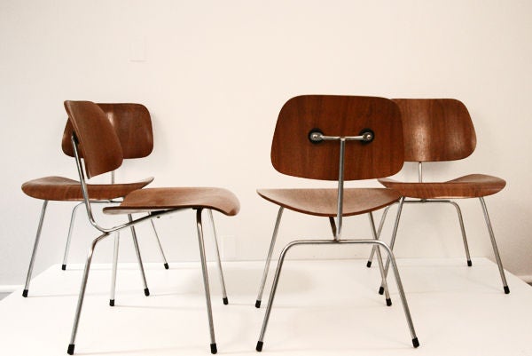 Four Early Eames Walnut DCM chairs by Herman Miller