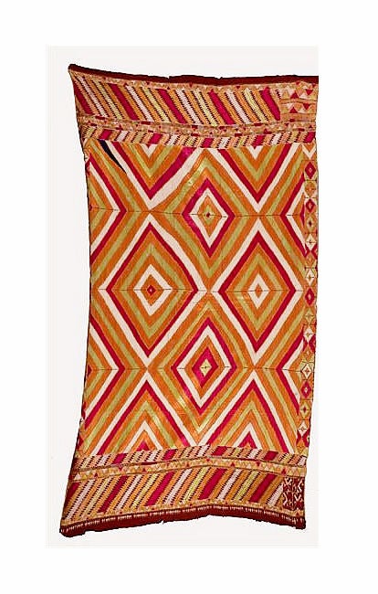 A 19th century Phulkari shawl from East Punjab, India. Darn stitches with silk threads to form the striking diamond and X-shaped pattern in a brilliant red, green, white and orange tones. Provenance available.
Please call the gallery to make sure