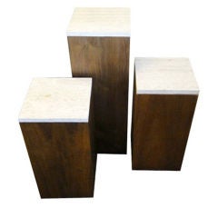 Three Mid Century Walnut and Travertine pedestals Stands
