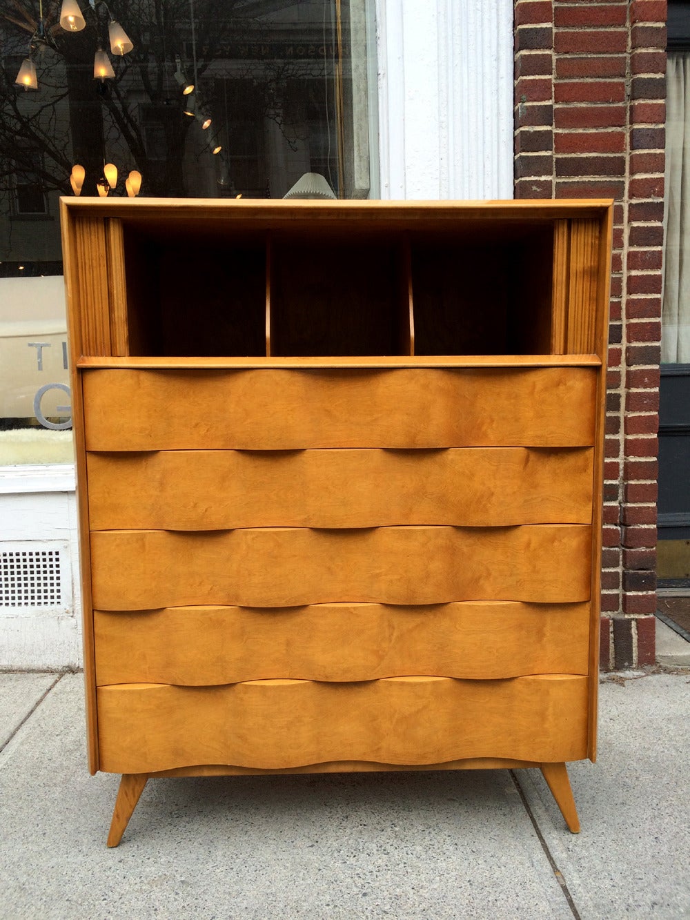 A very savvy Mid-Century Modernist tall dresser designed by Edmond Spence, circa 1950s, en suite with a matching double long dresser a pair of nightstand. The wavy front series features an unusual architectural undulating facade and the organic form