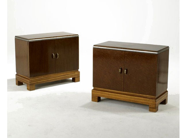 A pair of burl wood night stand on rosewood skirt and feet. Original brass and chrome hardware. The doors open to a self and a drawer. European origin from late art deco period, likely France.