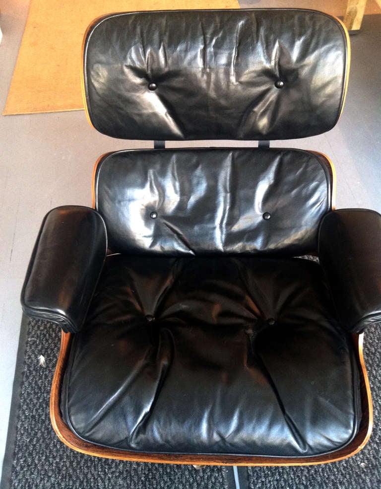 Early Charles Eames Rosewood lounge chair and ottoman 3