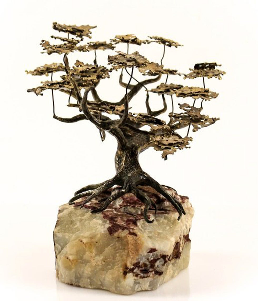 A small tabletop sculpture by C. Jere for Artisan House. A lone bonsai tree made of bronze with wind-swept leaves on gnarled branches and roots anchored into a piece of onyx rock. Poetic piece of work and one of the best examples in the artists'