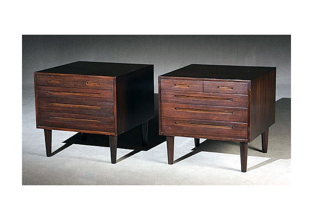 An early pair of cabinets on four wood feet designed by Edward Wormley for Dunbar. In the shape of classic gentleman's commode and chest of drawers, but will also make a pair of awesome large night stands. Mahogany with dark finish and warm patina.