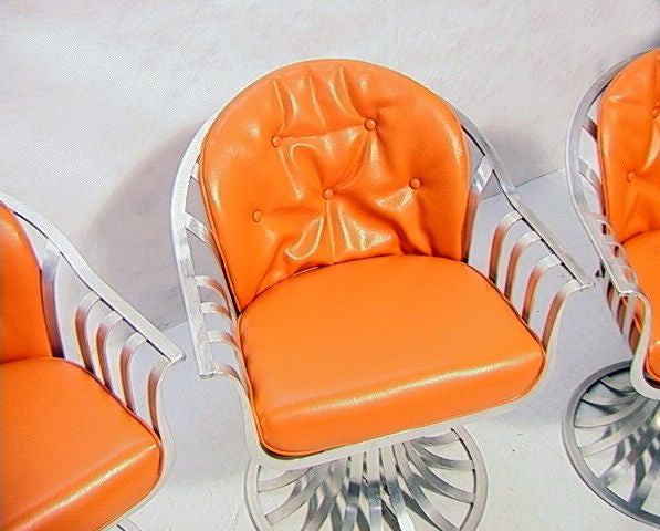 Mid-20th Century Four Russell Woodard aluminum swivel chairs
