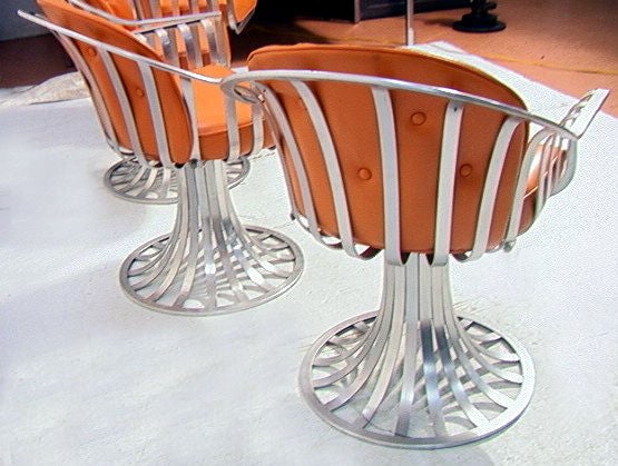 Four Russell Woodard aluminum swivel chairs 1