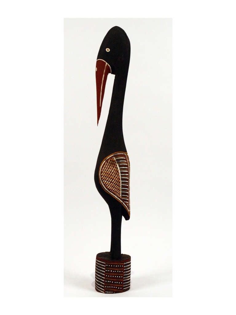 Made by artist Patrick Freddy Puruntatameri from Aboriginal art community on Tiwi islands, off the northern coast of Australia, this bird pole represents Japiru. It was carved from a single iron wood and painted with ocher with the clan designs.