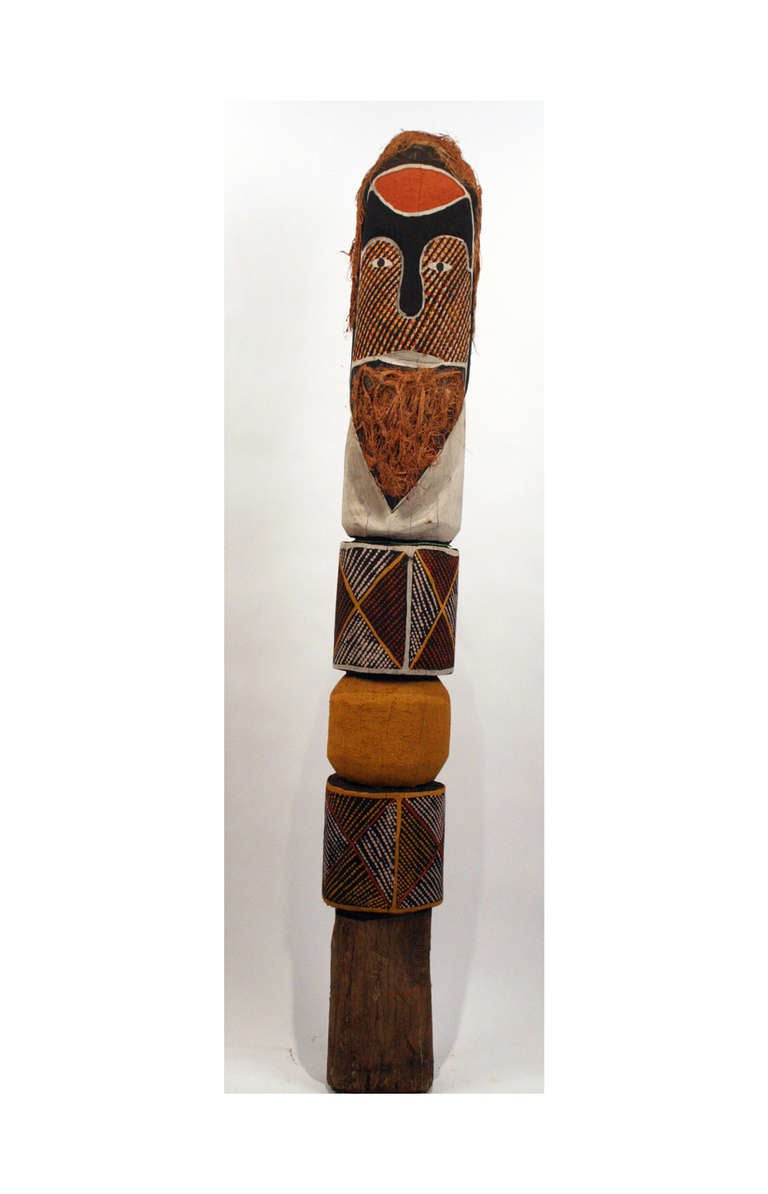 Blanket Lizard Kurruporani was a male ancestor figure in Dreamtime for the Tiwi clan. The statue was carved from dense local ironwood and decorated with clan specific pattern and coconut fibers. 
Artist: Wally Kerinauia
Nationality: