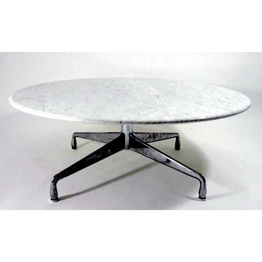 This rare custom-made oversized aluminum base coffee table has a stunning polished Carrera marble top and it is from the collection of a long time Herman Miller Employee who acquired it in 1970s. The table still retains Herman Miller label and has