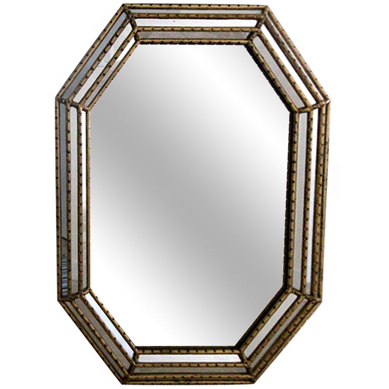 A large pair of octagonal mirror by La Barge. Set in a three tier gilt wood frame with multiple glass panels. Extremely well made and very heavy. Have the hardware on the back that allow hanging vertically or horizontally.
Price is for the pair.