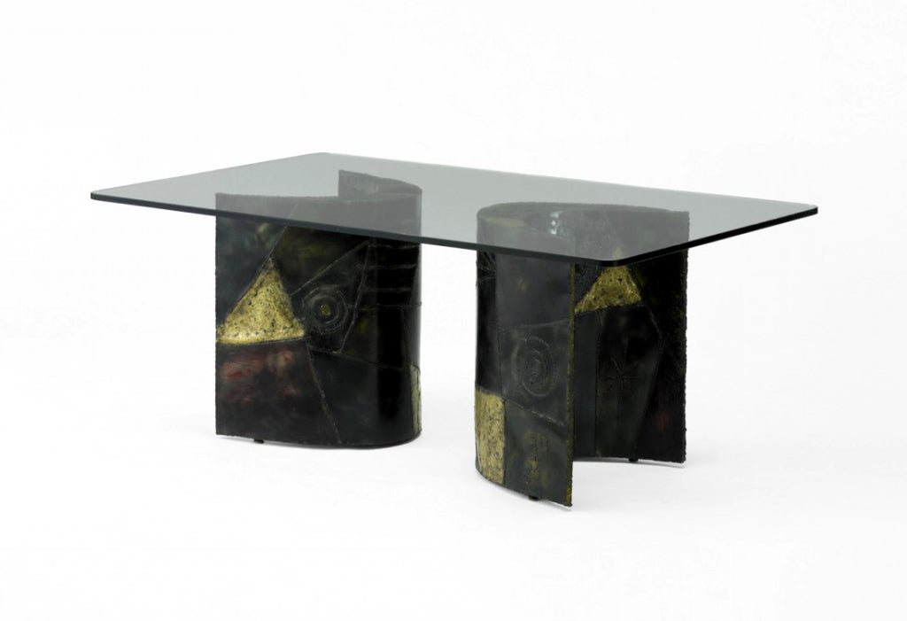 A beautifully hand crafted dining table by Paul Evans Studio circa 1968. It consists of two crescent shape pedestal welded with steel and decorated with bronze patchwork and surface sculpture that exemplifies Paul Evans' work. The two pedestals