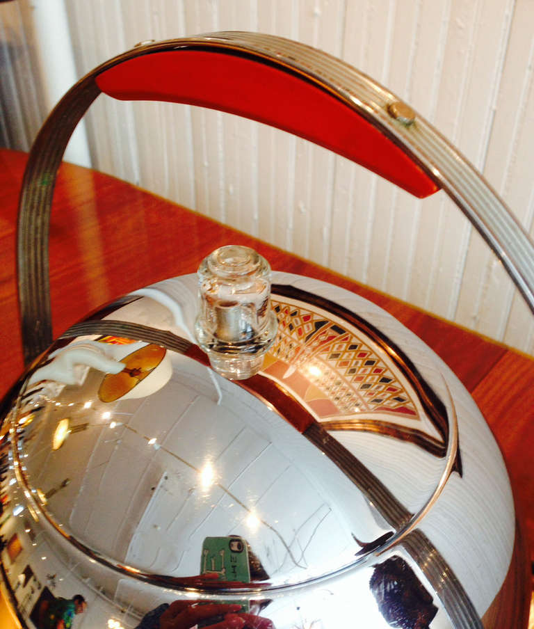 Designed in 1930s at the peak of American Art Deco and inspired by a prototype coffee machine designed by Eliel Saarinen for the 1933 Chicago World fair, this chrome coffee urn was called 