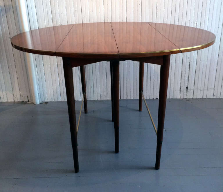 Mahogany Extension drop leaf dining table with brass band Paul McCobb