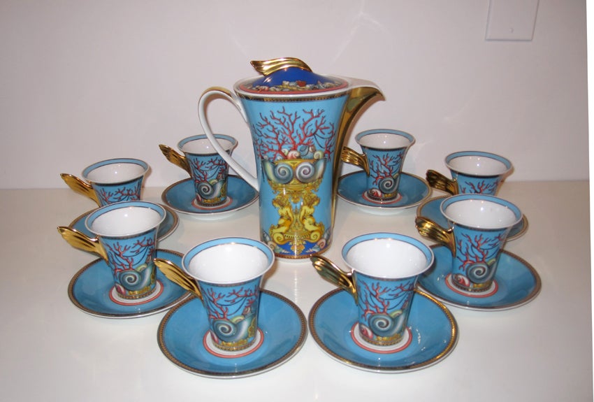 A gorgeous porcelain set of coffee or tea service in one of the most beautiful pattern Versace designed for Rosenthal "Les Tresors De La Mer". The service consists of a large pot with lid, eight cups with wing holder and eight saucers. All