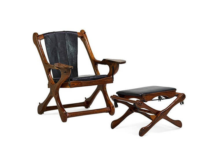 Crafted in beautiful rosewood, the lounge chair and ottoman was an iconic design by Don Shoemaker for Senal. The chair with a rocking seat and the folding ottoman both display stunning rosewood grains and patina. Original black leather shows lots of