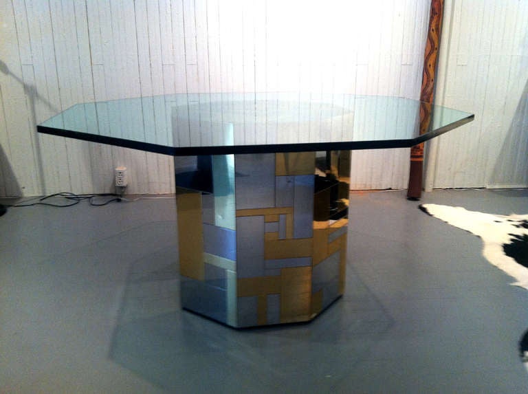 A center table in cityscape series designed by Paul Evans for Directional. Brass and chrome veneer with an original Paul Evan s Decal. The table is in an attractive octagonal form with a matching glass top of 48 by 48, 20 inch each side and 0.75