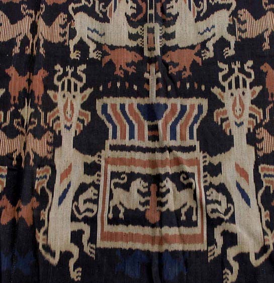 Large two panel seamed ikat ceremonial cotton hinggi with fringes. Collected in Sumba Indonesia. Traditional indigo background with animal depiction including snakes, lions and horses.
Please call the gallery to make sure this item is on display