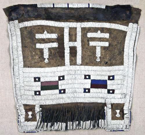 Ceremonial hide Apron called Mapoto with white and colored beads, circa late 19th C from South Africa. Mapoto iis worn by the women in Ndebele tribe at their wedding night. Made of goatskin and decorated with many fertility symbolism. This piece is