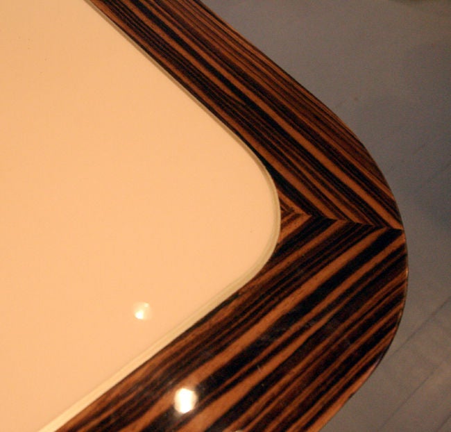 Part of Kagan's Radius collection, the large lacquered dining table is inset with lacquered beige top framed by exotic Madagascar Ebony. In an updated Art Deco style. It can be used as a large stunning desk for office or library as well.

This