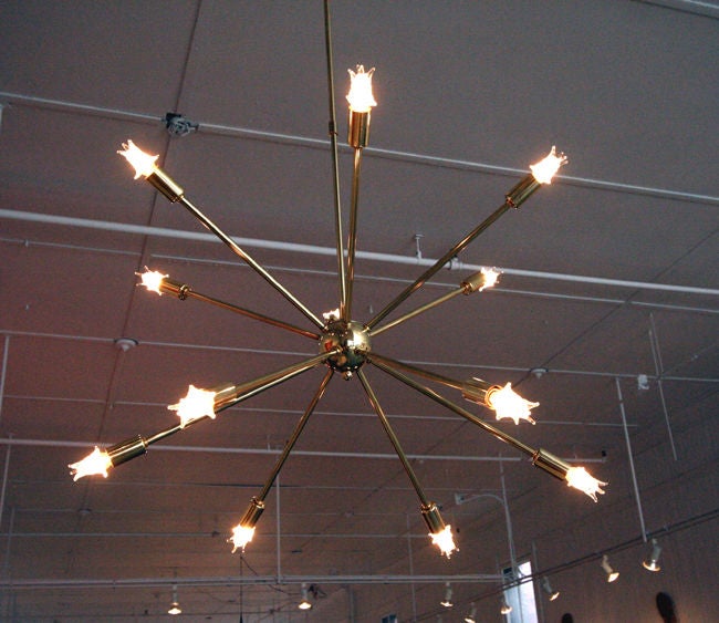 Nice vintage 12 arm sputnik chandelier from 50s. Still has 12 vintage star shape light bulbs. Brass finished construction. Rewired and restored.
This item is located at Tishu Hudson.