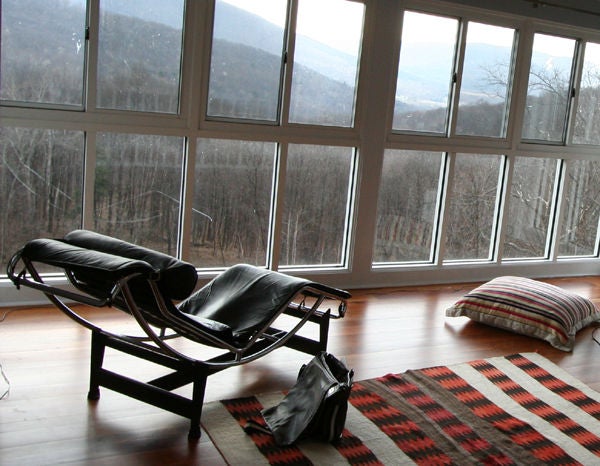 Transitional Navajo weaving in a banded and zigzagging geometrical pattern. Red, cream and brown color.