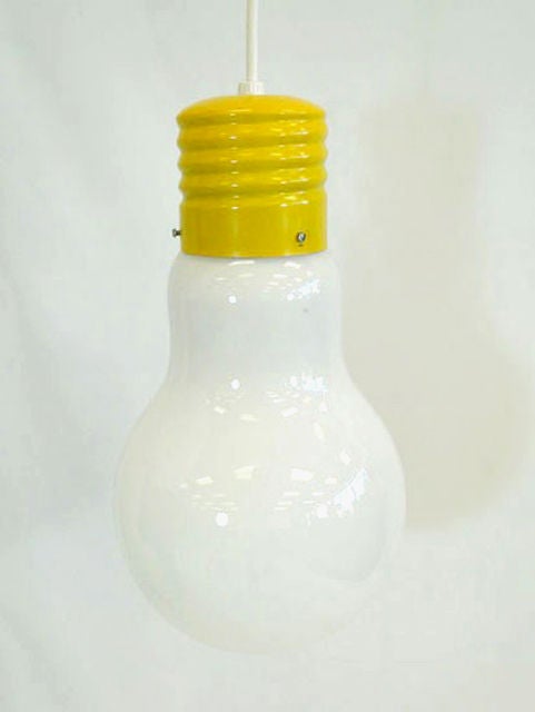 A large bright yellow pop art light bulb pendant light from 60s.